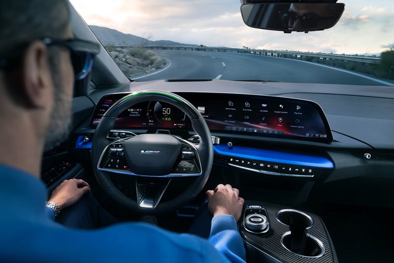 Front View of the 2026 OPTIQ-V Driving Through the Dusk Utilizing its Headlights | Wheeler Chevrolet Cadillac in Yuba City CA